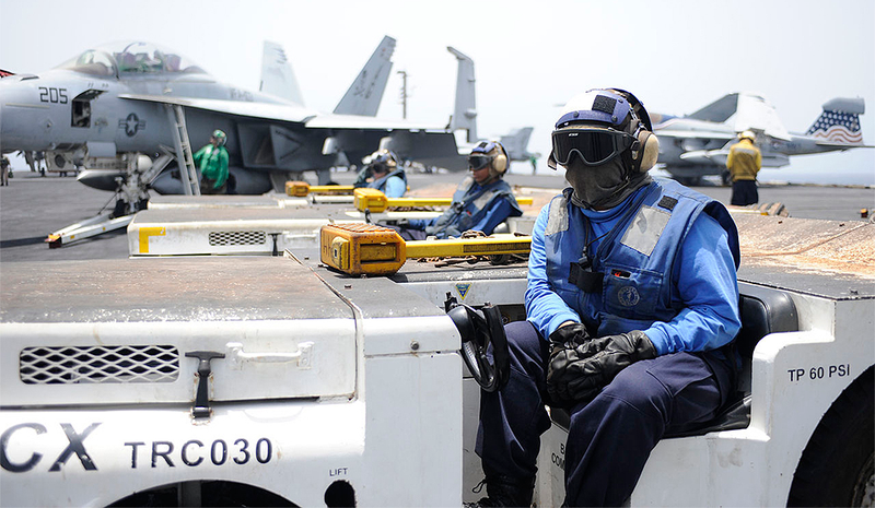 Illustration for article titled Here Is What All Those Colored Shirts Mean On An Aircraft Carrier's Deck